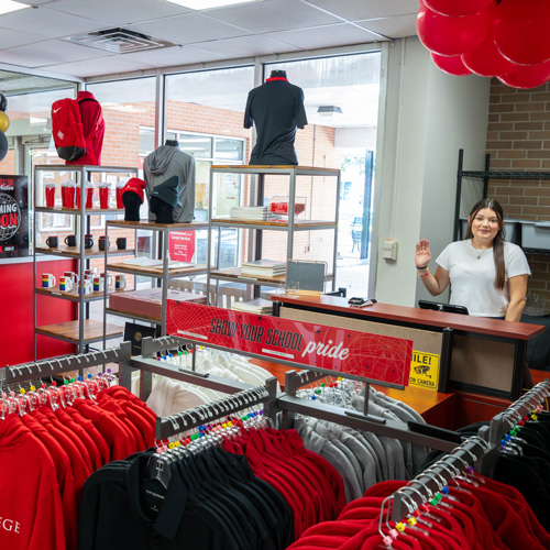 Navigator Nation Store, with worker and merchandise