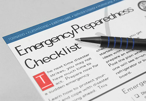 An emergency preparedness checklist and a pen