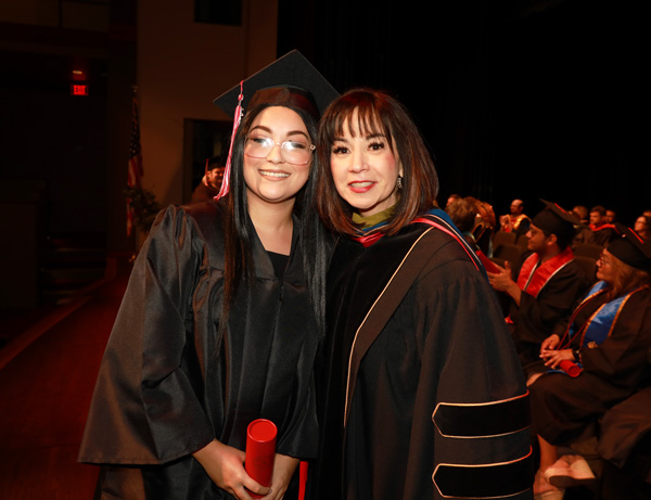 Crystal Rios poses with Dr. Lynda Villanueva at Rios' graduation