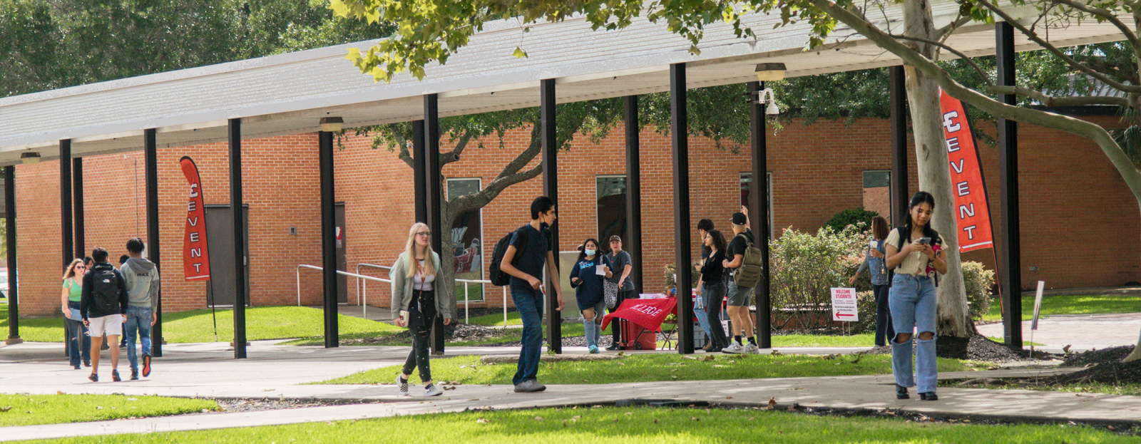 Students attend a welcome event outdoors on the main campus