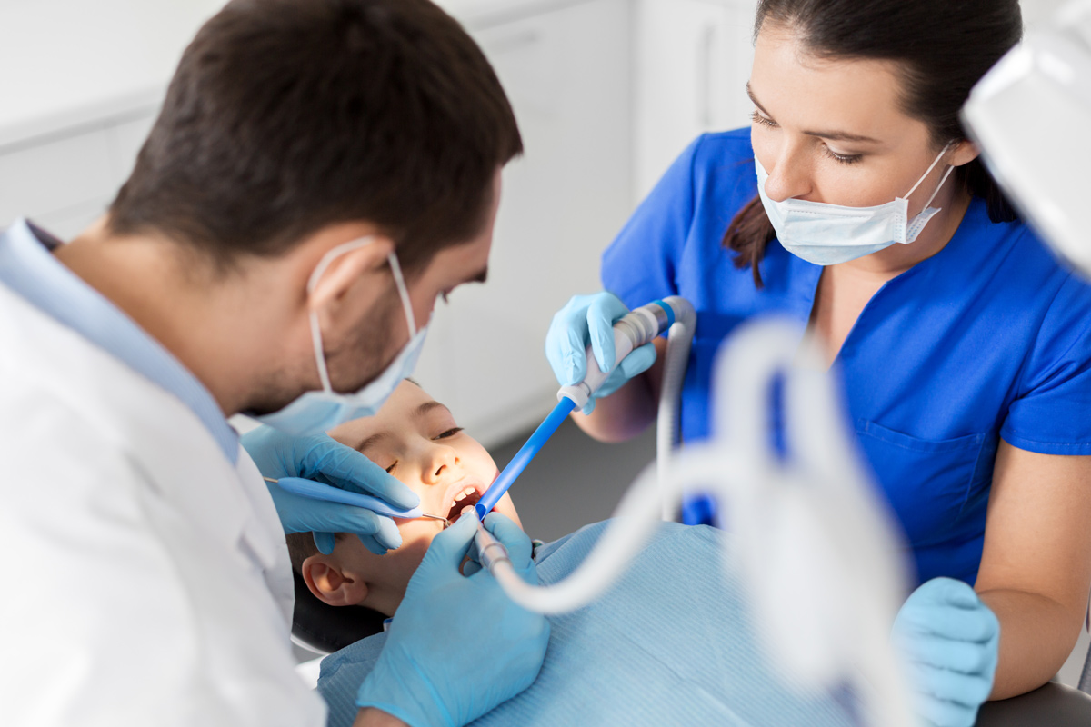 A patient receives treatment at a dentist's office